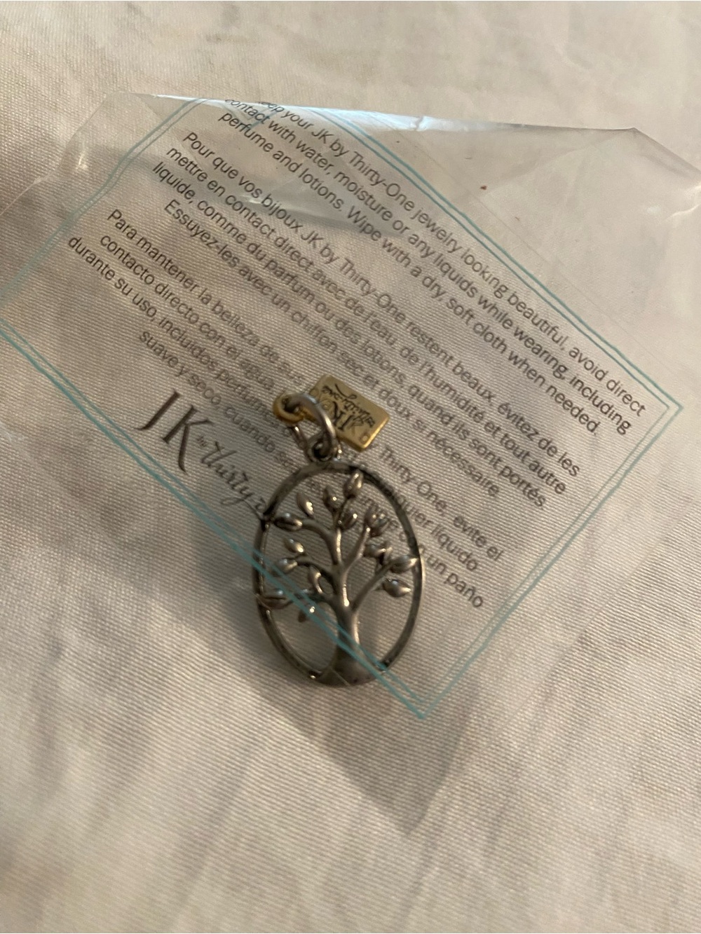 thirty-one Silver Tree of Life Pendant with Gold Tag